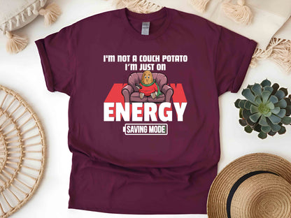 I'm Not a Couch Potato, I'm in Energy Saving Mode T-Shirt – Funny Humor Tee, Perfect Gift for Relaxation Enthusiasts